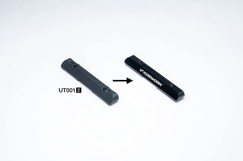 Koswork RC aluminum upgrade part next to original black plastic UT0012 part, side by side.