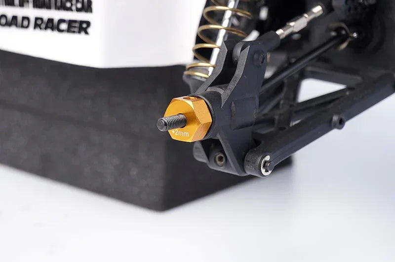 Koswork RC car aluminum 2mm hex wheel hub adapter, gold color, close-up view