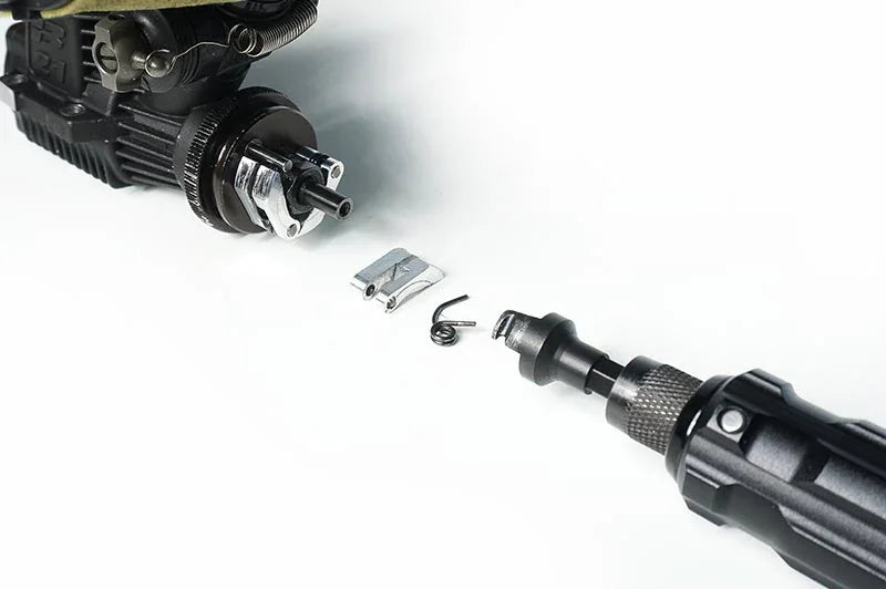 RC clutch assembly parts and tool on white background, closeup for repair or maintenance