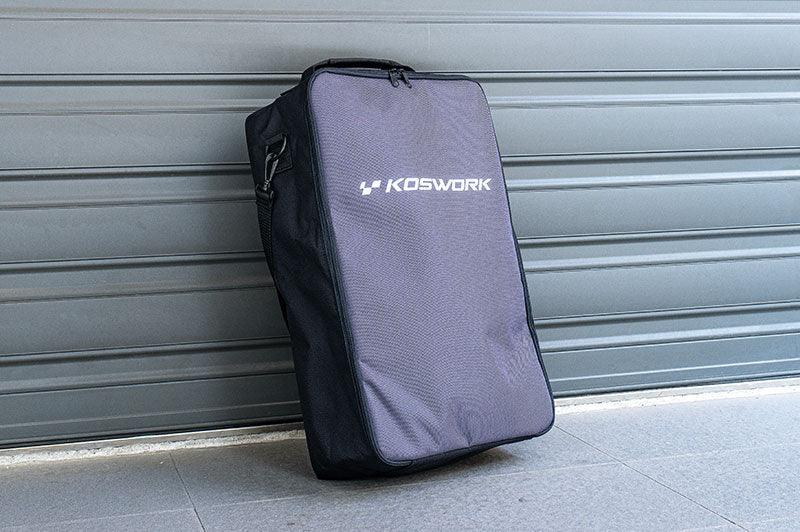 Koswork RC pit bag with zipper and handle, standing upright on a concrete floor