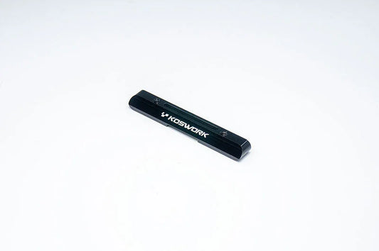 Koswork black aluminum RC car chassis brace part on white background
