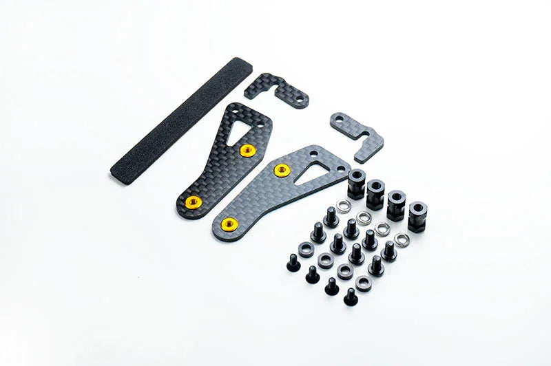 RC car carbon fiber upgrade parts set with screws, washers, spacers on white background