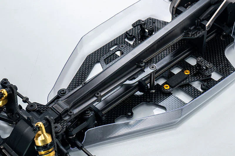 Carbon fiber RC car chassis with metal shock absorbers and precision components
