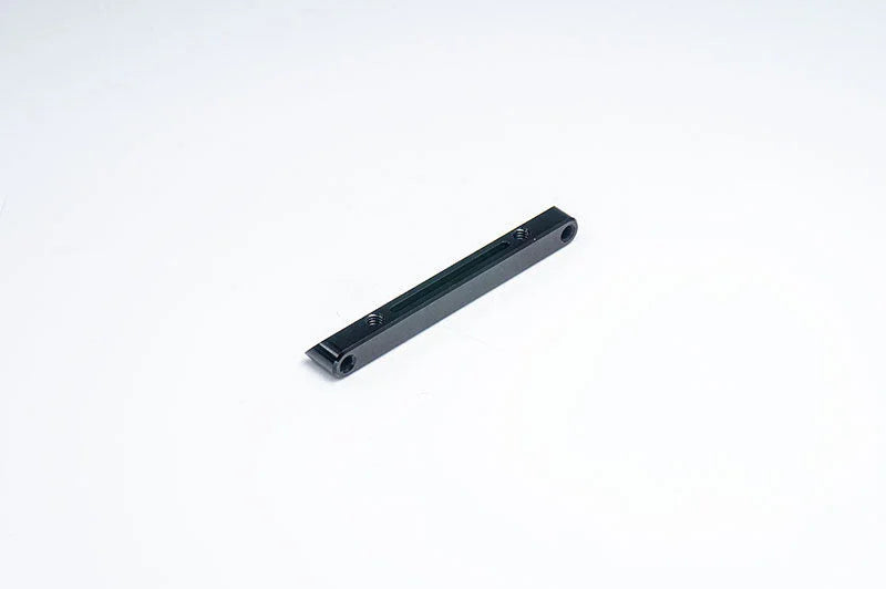 Black aluminum RC car suspension arm link part on white background