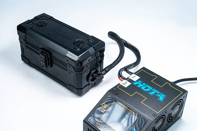 RC battery case connected to digital charger for remote control car accessories