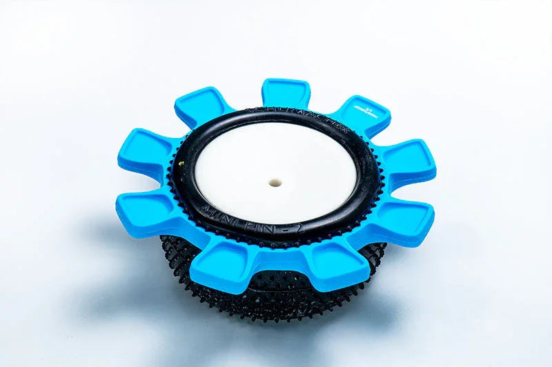 Blue RC tire insert tool on black racing tire for remote control car maintenance
