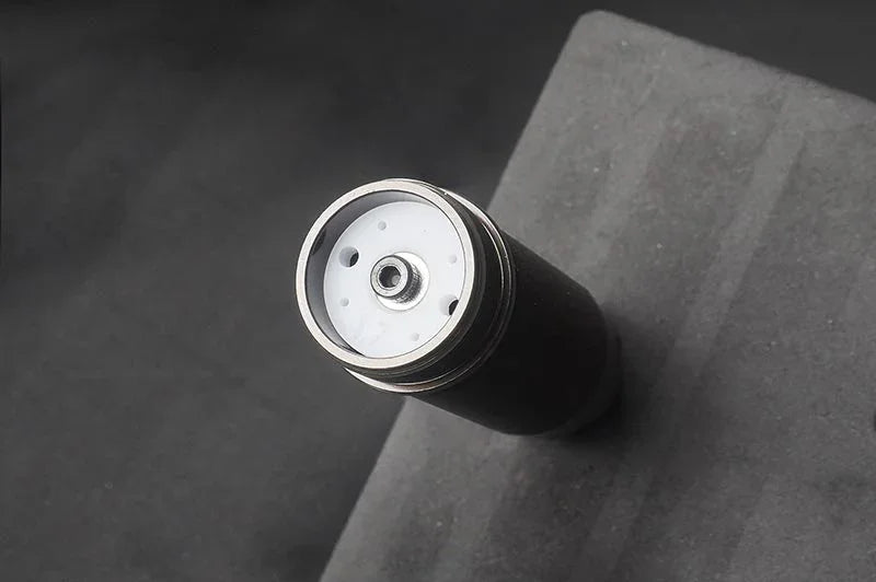 Close-up of RC shock absorber part on foam mat for remote control car maintenance