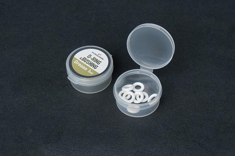 Koswork O-ring bushing grease 1ml for RC cars, small clear plastic container, white rings visible