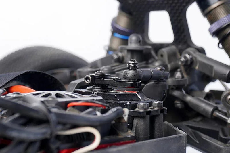Koswork RC car accessory KOS04021, close-up of black servo mount and components