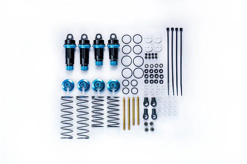 RC car shock absorber kit with blue aluminum shocks, springs, O-rings, rods, and accessories