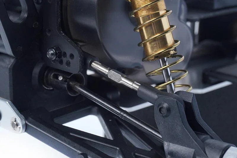 Koswork RC car metal turnbuckle near shock absorber, close-up of suspension part, KOS04301-3
