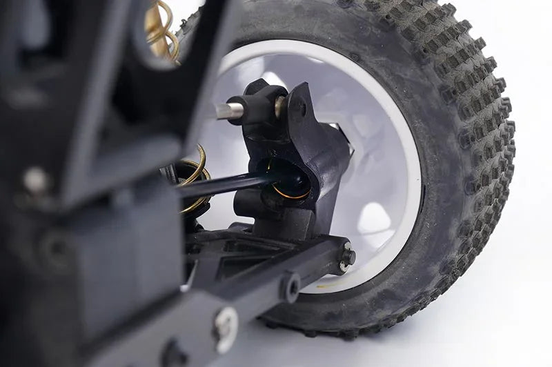 Koswork RC car rear wheel assembly, black suspension arm, off-road tire, close-up detail