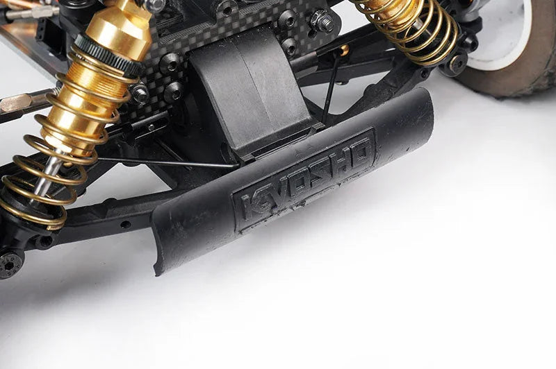 Close-up of RC car rear suspension with metal shocks and black plastic bumper