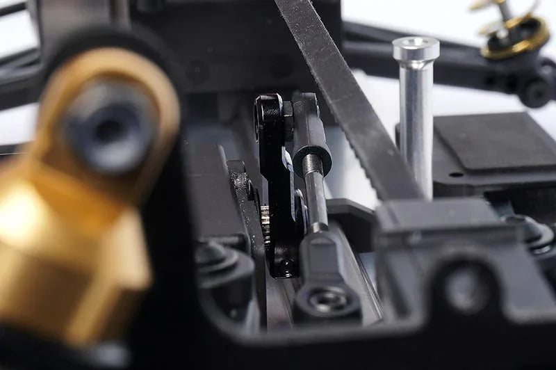 Koswork RC car accessory KOS04318 close-up, precision metal linkage and black chassis parts