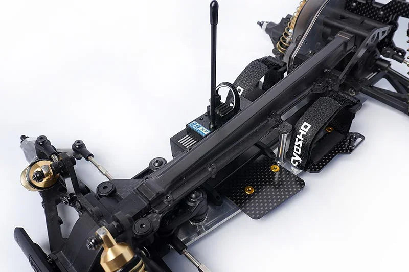 Koswork RC car chassis with carbon fiber parts, Velcro straps, black and gold hardware accessories