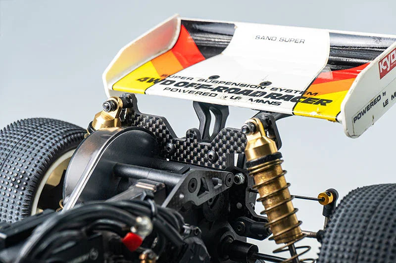 Koswork RC car rear wing, carbon fiber shock tower, off-road racing accessory, white and yellow.