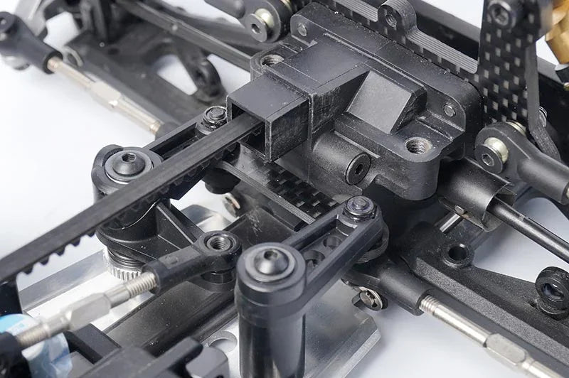 Koswork RC car black plastic steering assembly close-up, durable parts for racing models