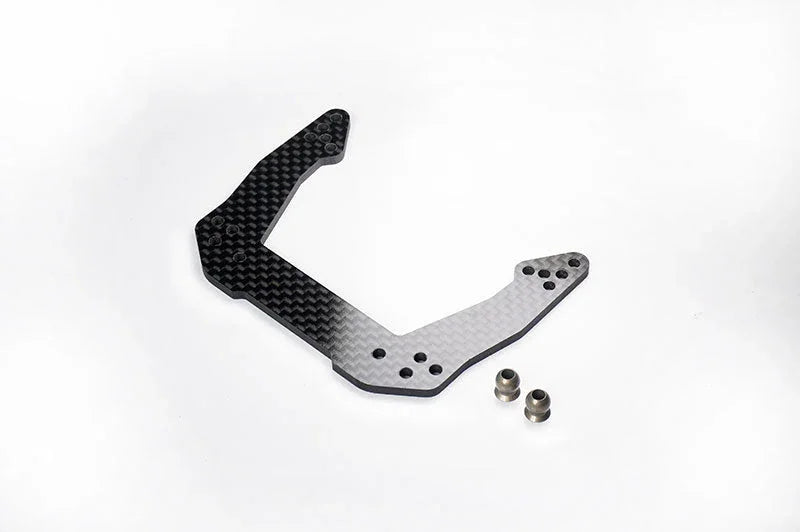 Carbon fiber RC car shock tower with two metal spacers on white background