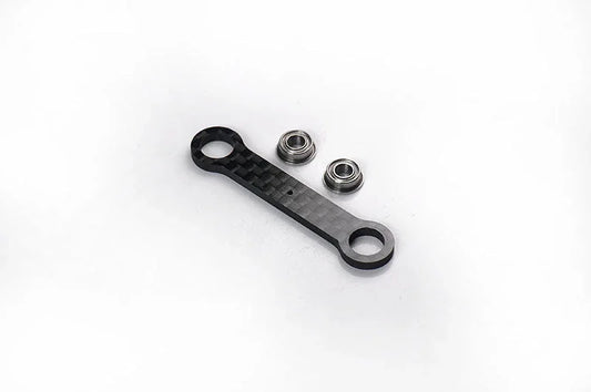 RC carbon fiber steering link with two metal ball bearings on white background