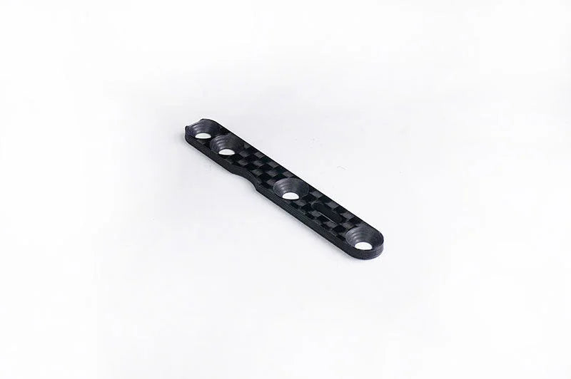 Carbon fiber RC car chassis plate with four mounting holes on a white background.