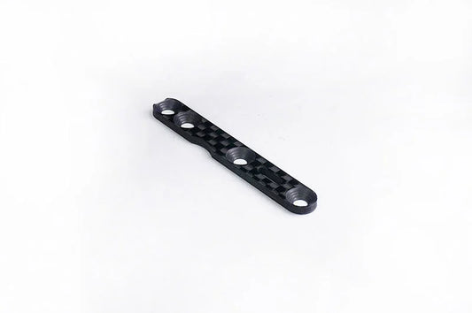 Carbon fiber RC car chassis plate with four mounting holes on a white background.