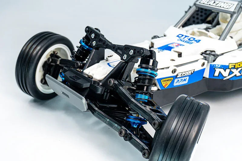 Close-up of RC buggy front suspension, shock absorbers, and detailed race decals