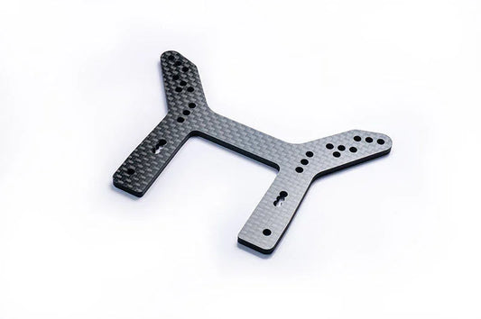 Carbon fiber RC car shock tower with multiple mounting holes on a white background