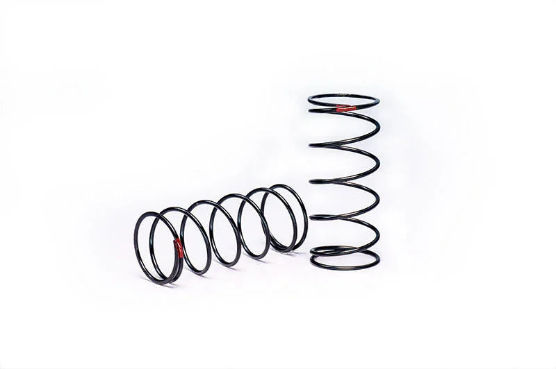 Pair of black RC car suspension springs on white background, coil springs for radio control vehicles