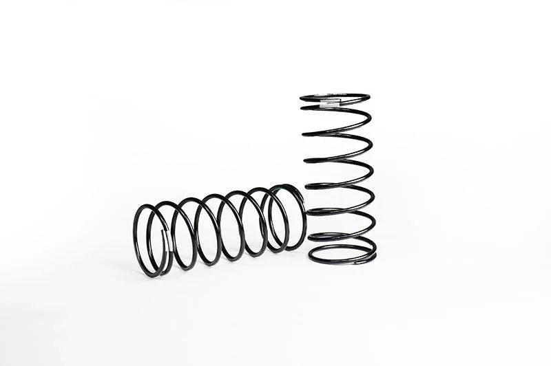 Pair of black metal RC car springs on white background for remote control suspension