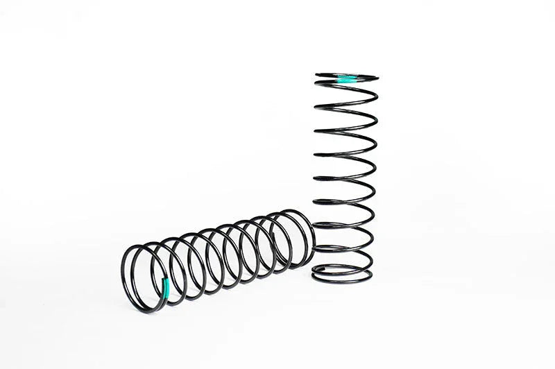 Pair of black RC car suspension springs on white background, ideal for remote control vehicle parts.