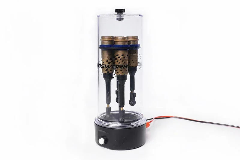 RC shock absorber vacuum bleeder with clear chamber and three mounted shocks