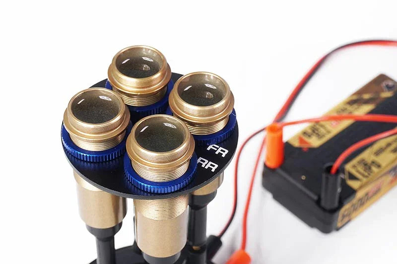 RC shock absorber oil filling station with four shock holders and battery, pit tool for hobby racing
