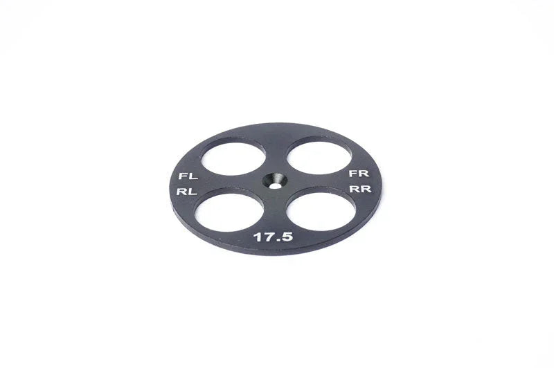 Black metal RC setup wheel gauge with four holes and white position markings, 17.5 size.
