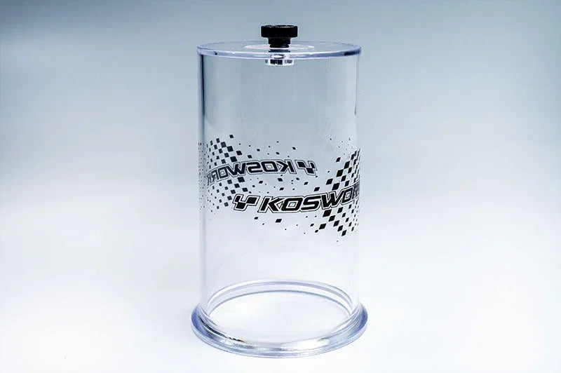 Clear acrylic RC tire glue drying clamp with Koswork logo and checkered graphic