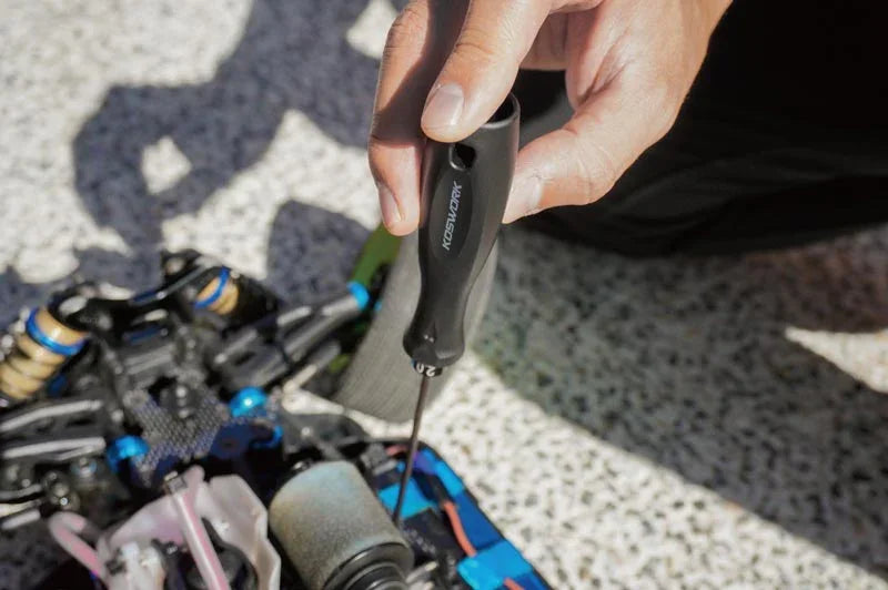 Koswork RC car tool with black handle used for RC car maintenance outdoors