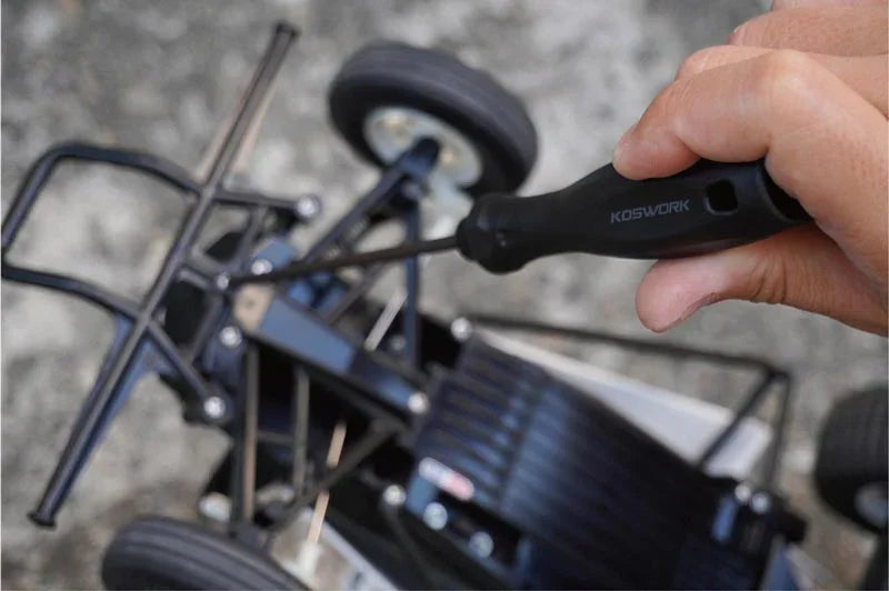 Koswork RC car tool with black handle in use on RC car part, ergonomic design visible