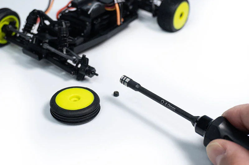 Koswork 4.0mm hex driver tool for RC car, black handle, shown with RC car and yellow rim wheel.