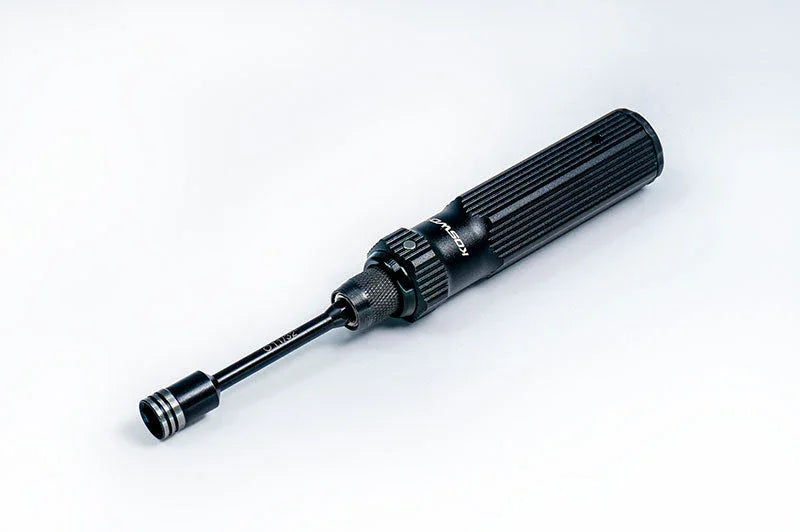 Precision RC nut driver tool with black textured handle on a white background
