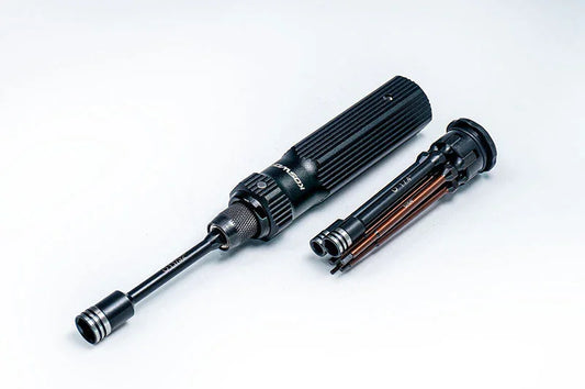 Multi-bit RC tool with black handle and interchangeable driver bits on white background