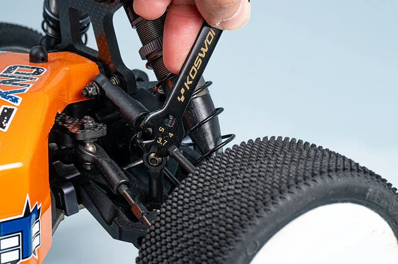 Measuring RC car suspension with Koswork camber gauge tool on off-road buggy