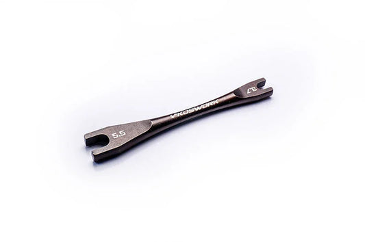 Double-ended RC wrench tool with open ends labeled 5.5 and 7.0 on white background
