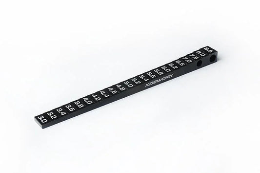 Koswork KOS13351-1 black aluminum RC ride height gauge with white markings.