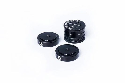 Black RC car ride height gauge set with white markings on a white background