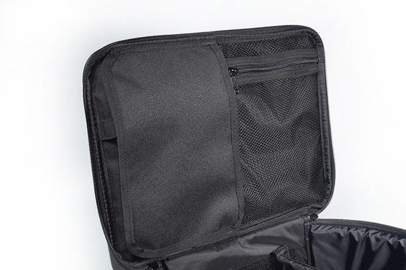 Interior view of black RC pit bag with mesh zip pocket and storage compartments