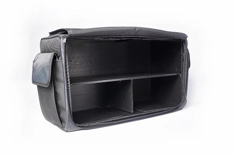 Black RC pit bag with open compartments and side pocket on white background