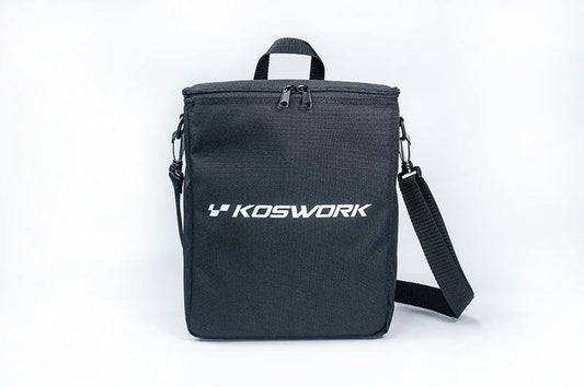 Black Koswork RC pit bag with shoulder strap and top zipper, isolated on white background