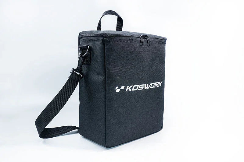 Black Koswork RC pit bag with shoulder strap and zipper, isolated on white background