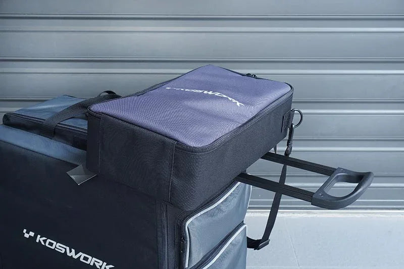 Koswork RC car pit bag KOS32266, black nylon, compact size, shown on rolling case for accessories