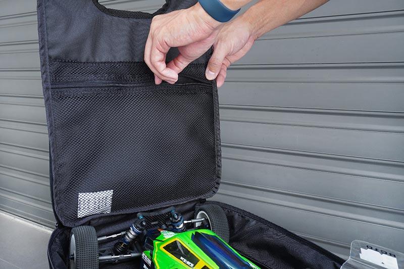 Koswork RC car carrying bag with mesh pockets, black fabric, holding a green RC car, KOS32267-6.