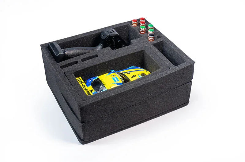 Foam organizer case holding RC car, remote control, and accessories for hobby storage